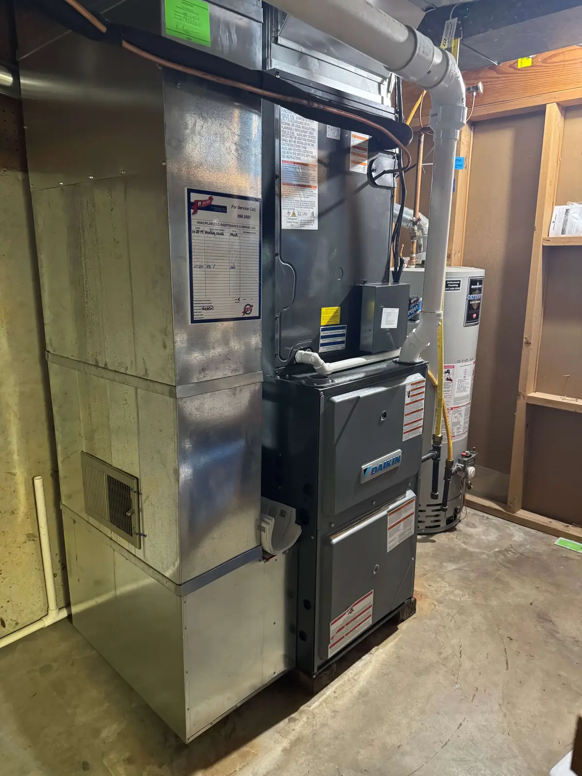 High-efficiency Daikin furnace and water heater installed in a Springfield basement