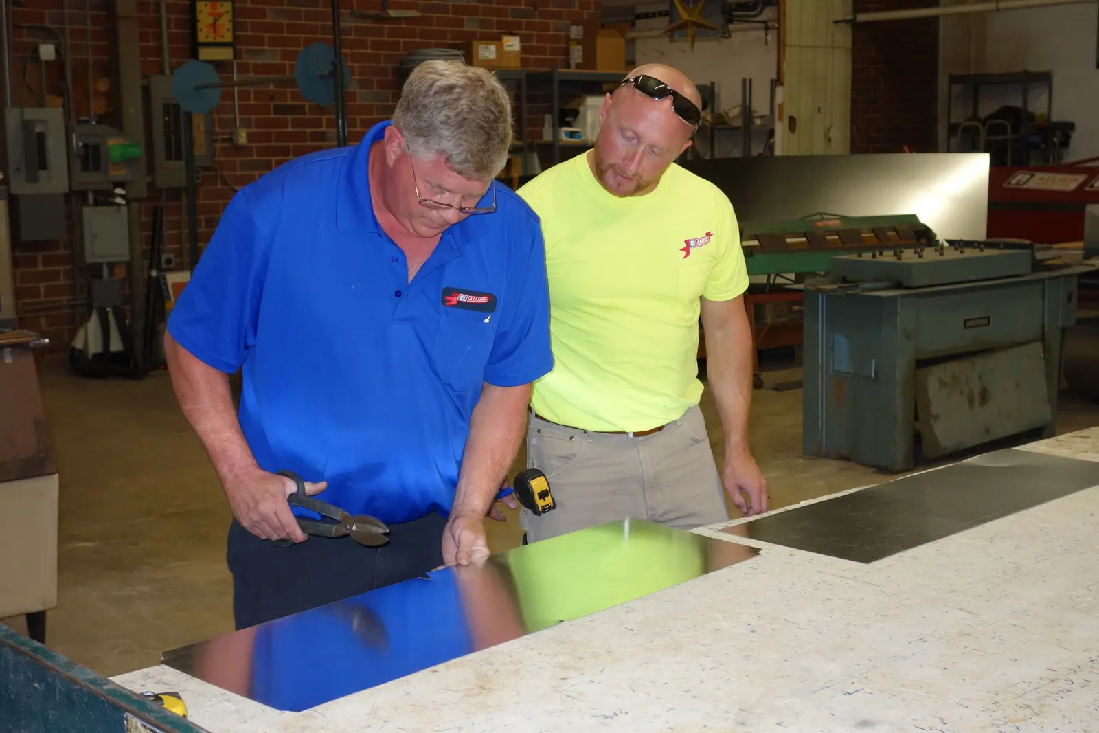 Allied technicians fabricating sheet-metal ductwork in the Springfield shop
